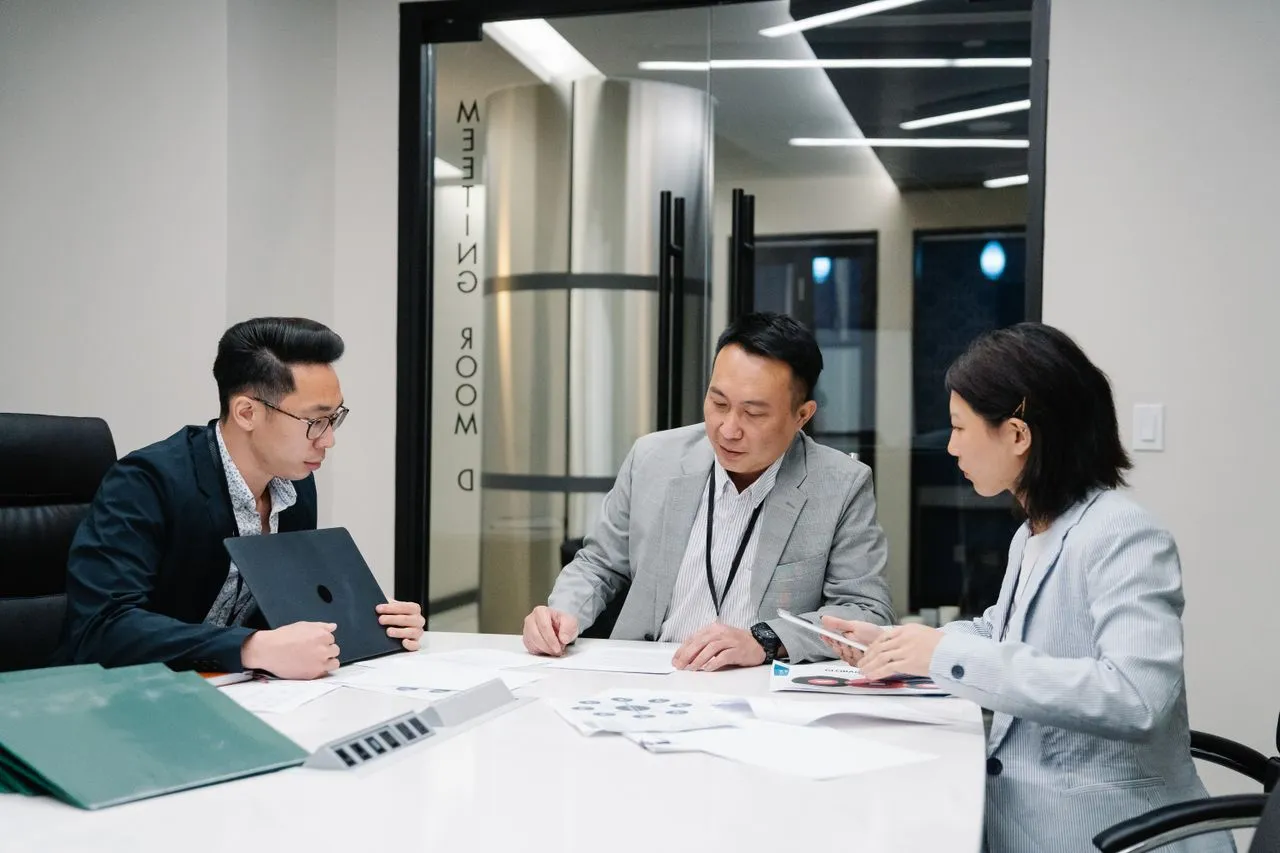 Business team reviewing internal systems and processes in Malaysia